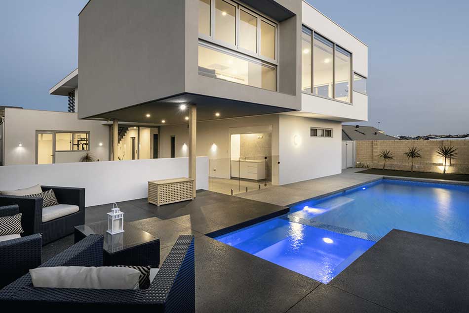 pool and seating area with concrete floor