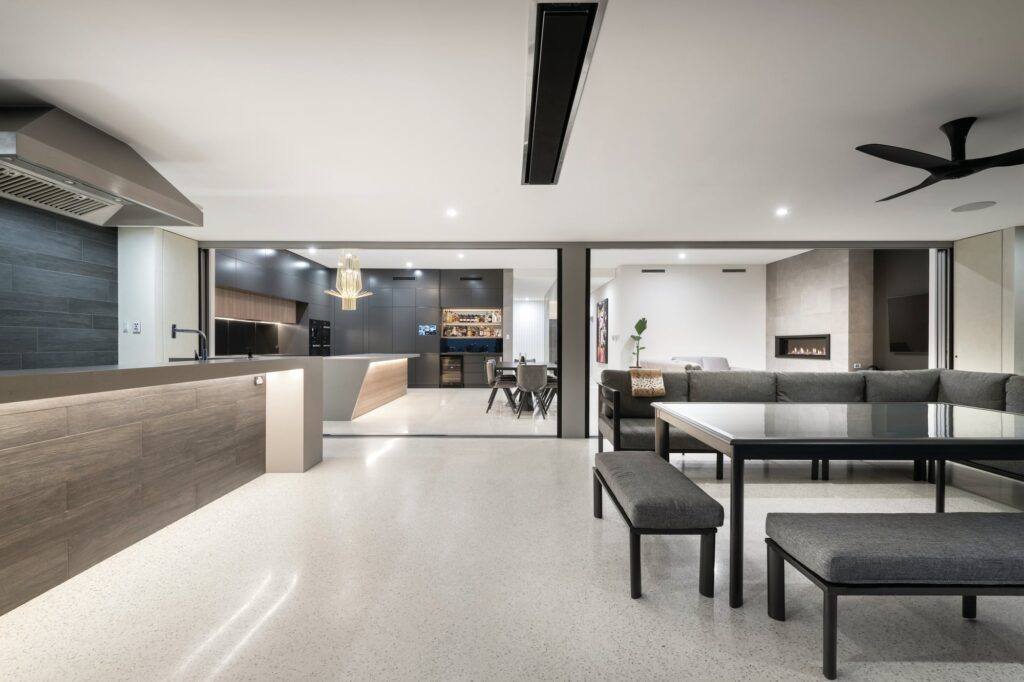 Modern living room set on a polished white concrete floor
