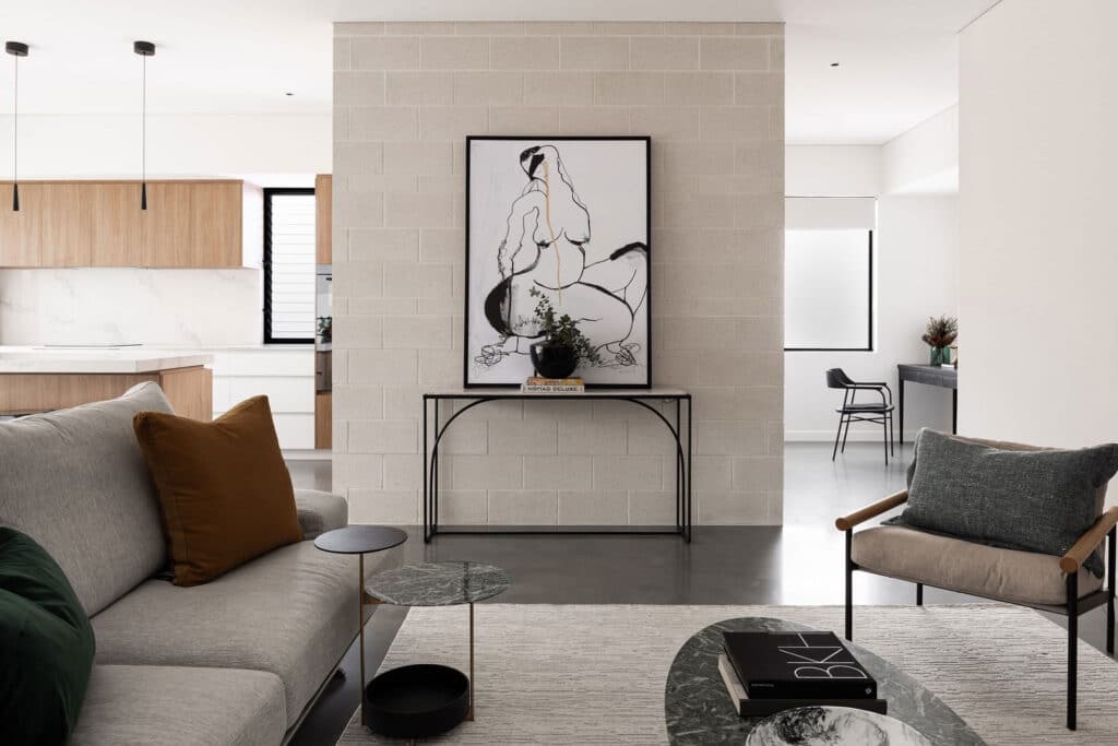 Impressionist artwork hung on a wall above polished concrete floor