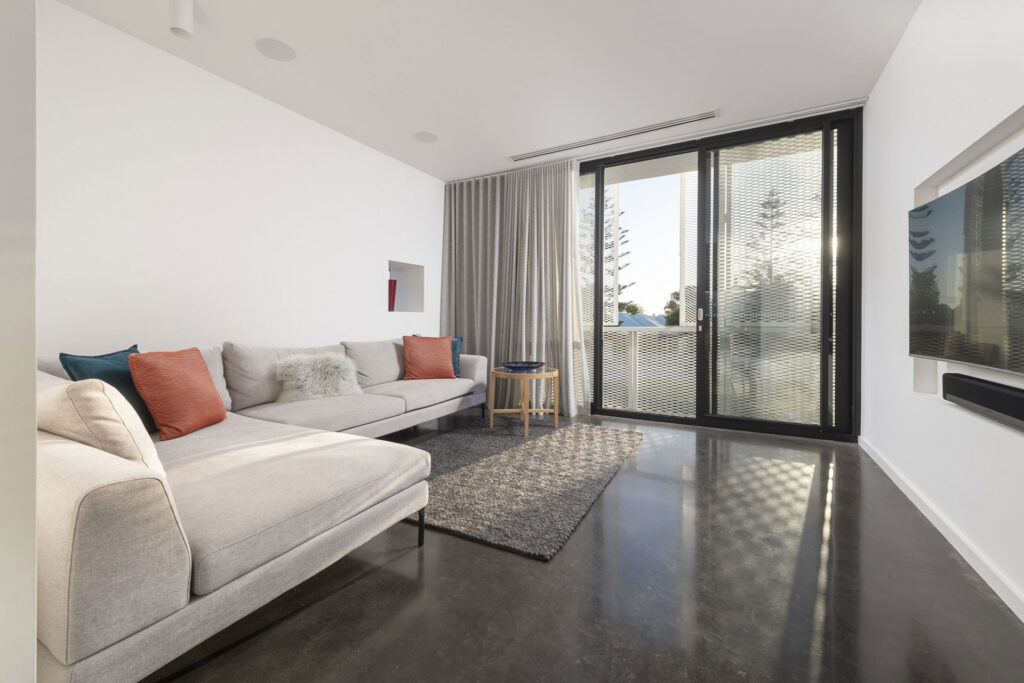 Living room set on a black polished concrete floor