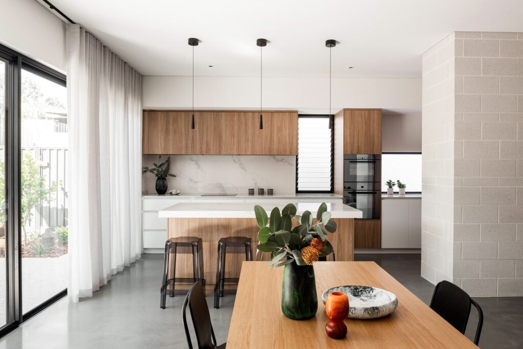 Modern kitchen and dining area on a grey concrete floor